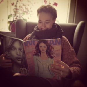 A women reading a fashion magazine