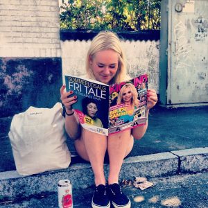 A woman reading a fashion magazine