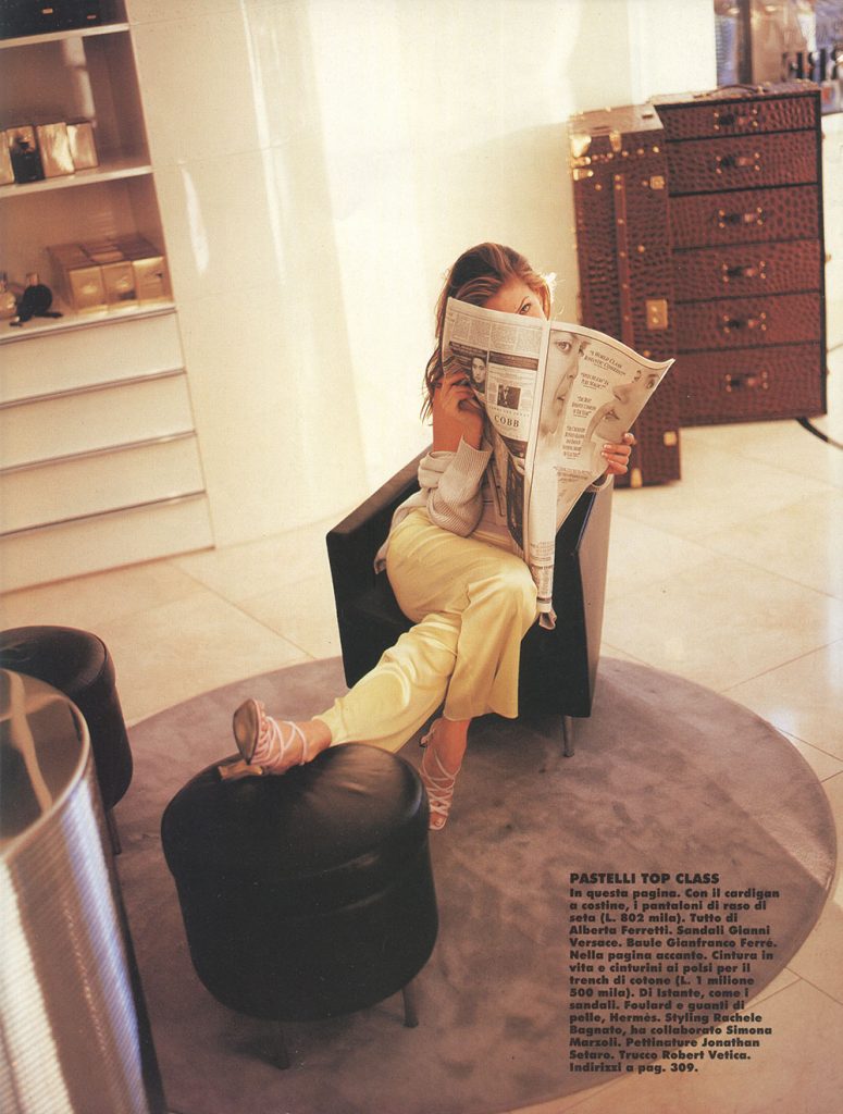 A woman from the magazine ELLE Italy, is reading a newspaper